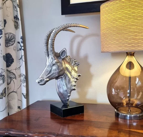 Sable Head sculpture on marble base